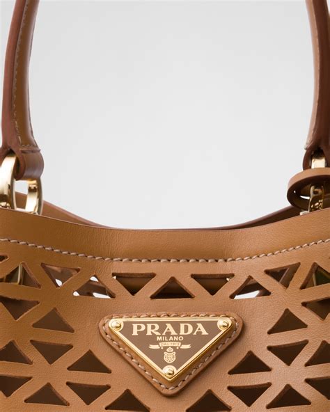 prada white laser cut|Prada Panier Leather Mini.